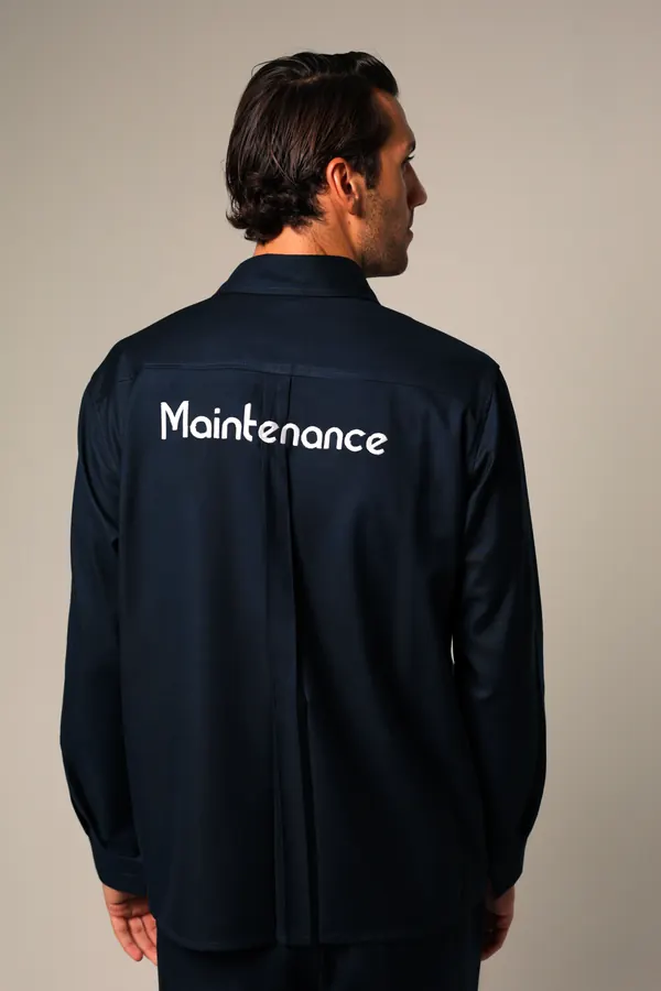 Navy work shirt with Maintenance printed across the back