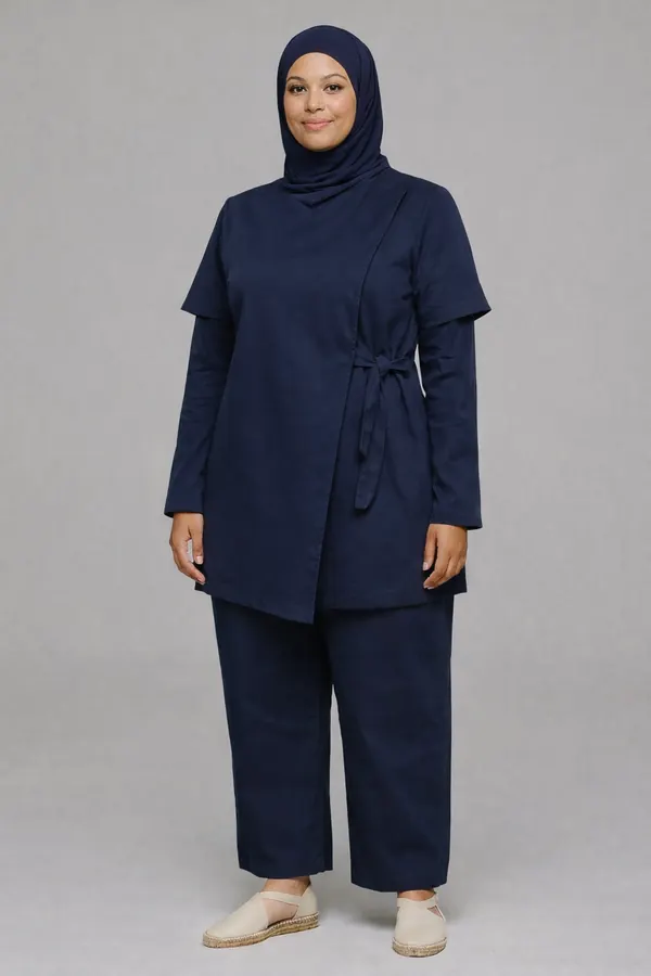Navy wrap tunic and trousers worn with a navy hijab