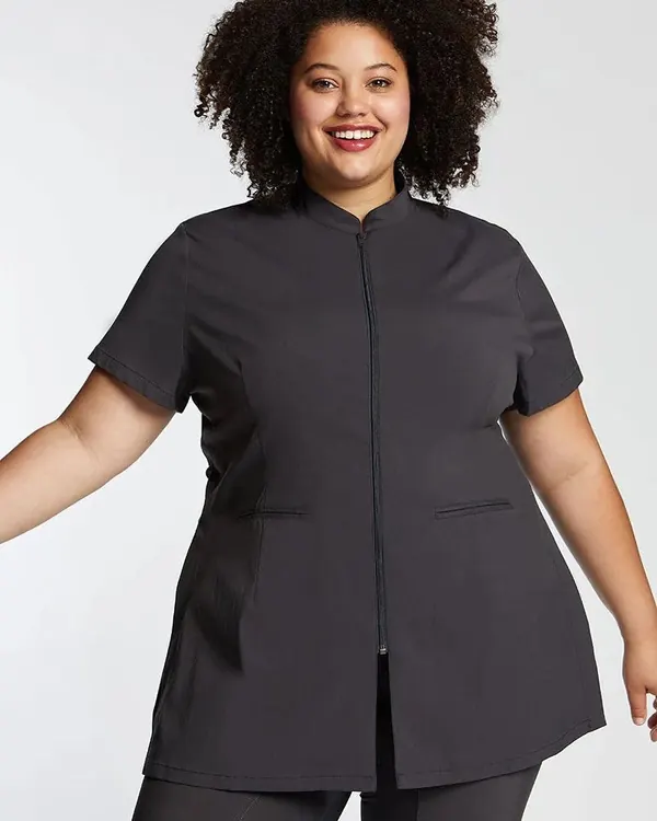 Woman in a charcoal short-sleeve zip tunic and trousers